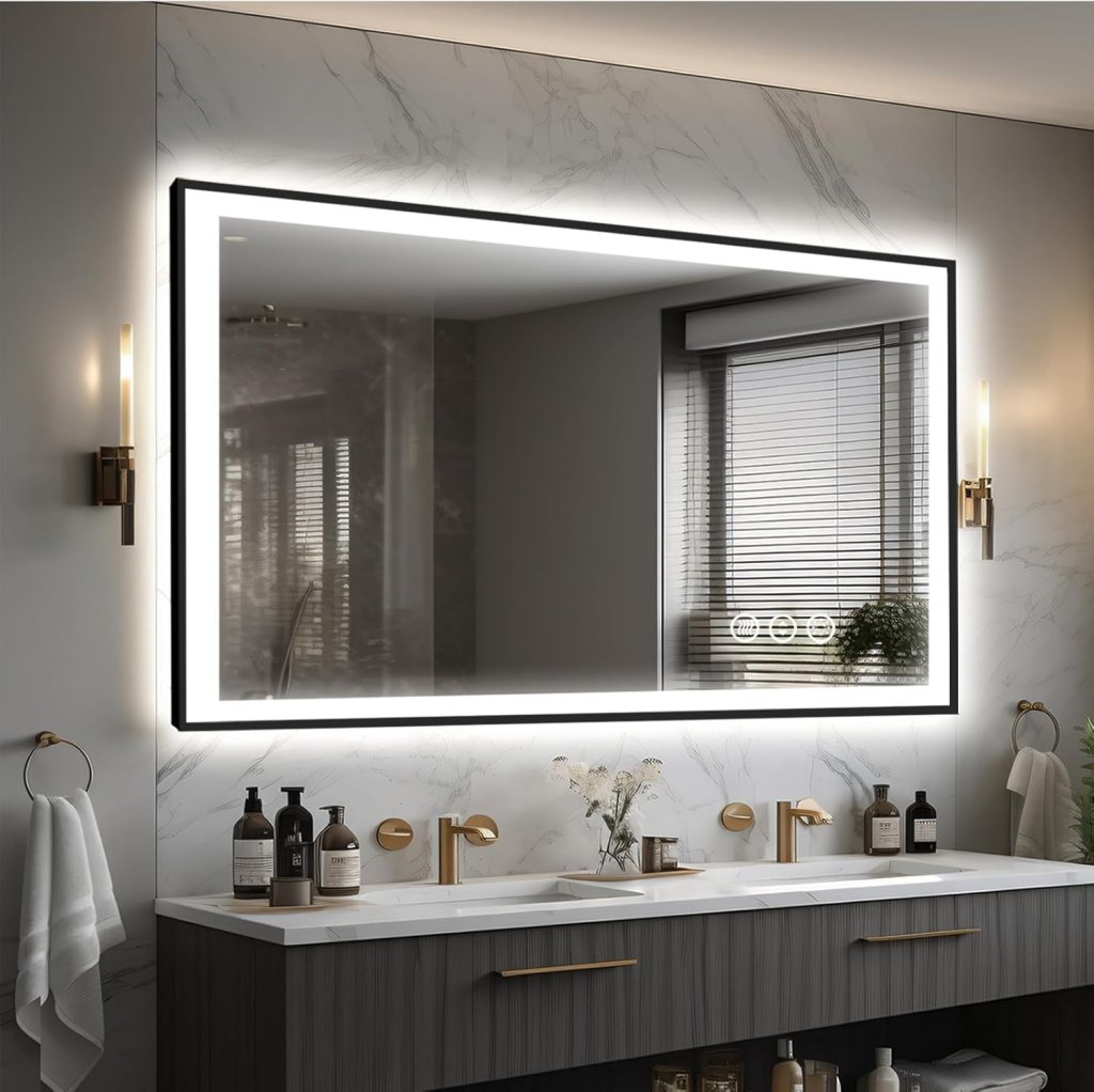 A modern bathroom featuring a large illuminated mirror above a sleek vanity, with gold fixtures and bottles of toiletries displayed on the countertop.