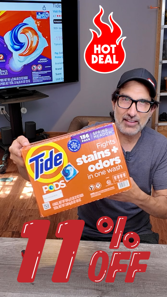 A person holding a box of Tide Pods, featuring text that highlights 'Fights stains + odors in one wash' and showing a discount of '11% OFF'. In the background, a television displays Tide product details.